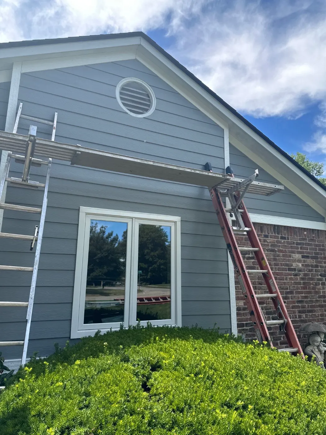 Siding installation documented in Holliday Park